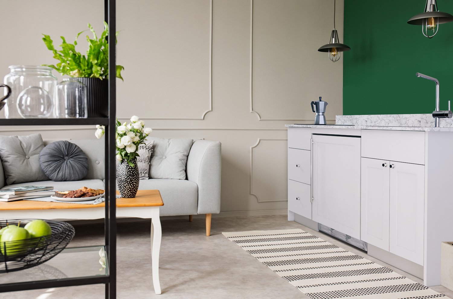 ADA-height Turnkey Caldera Kitchen featuring pre-assembled cabinetry and countertop in white, complete with ENERGY STAR certified refrigerator-freezer, ENERGY STAR certified 115V induction cooktop, storage drawers, and sink with faucet; ships in two boxes on one pallet